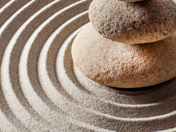 pebbles on sand circles